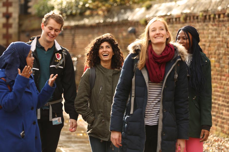 group of students walking together and laughing