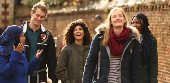 group of students walking together and laughing